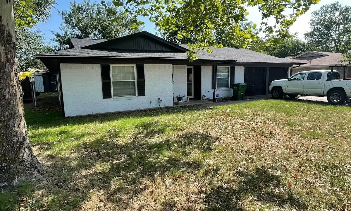 Professional roofing crew working on a residential roof in Douglasville